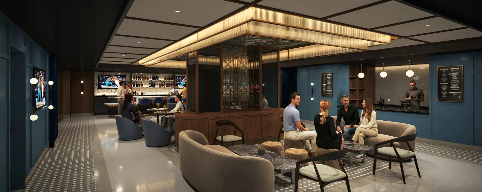 The Brasserie lounge with curved sofas, blue walls, and a bar in the background