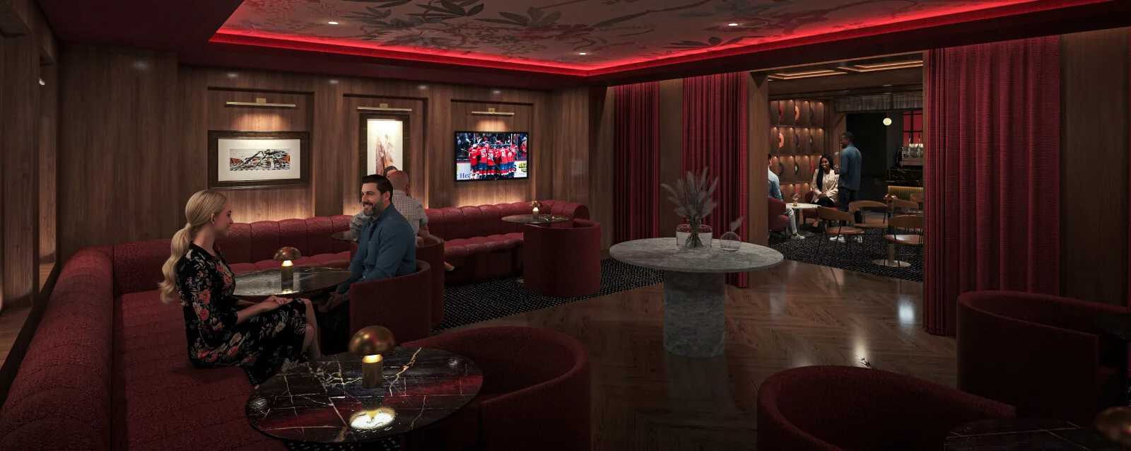 The Speakeasy seating area with intimate tables and a stage for live entertainment